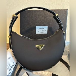 Authentic Prada Arqué Re-Nylon and brushed leather shoulder bag. Not used.